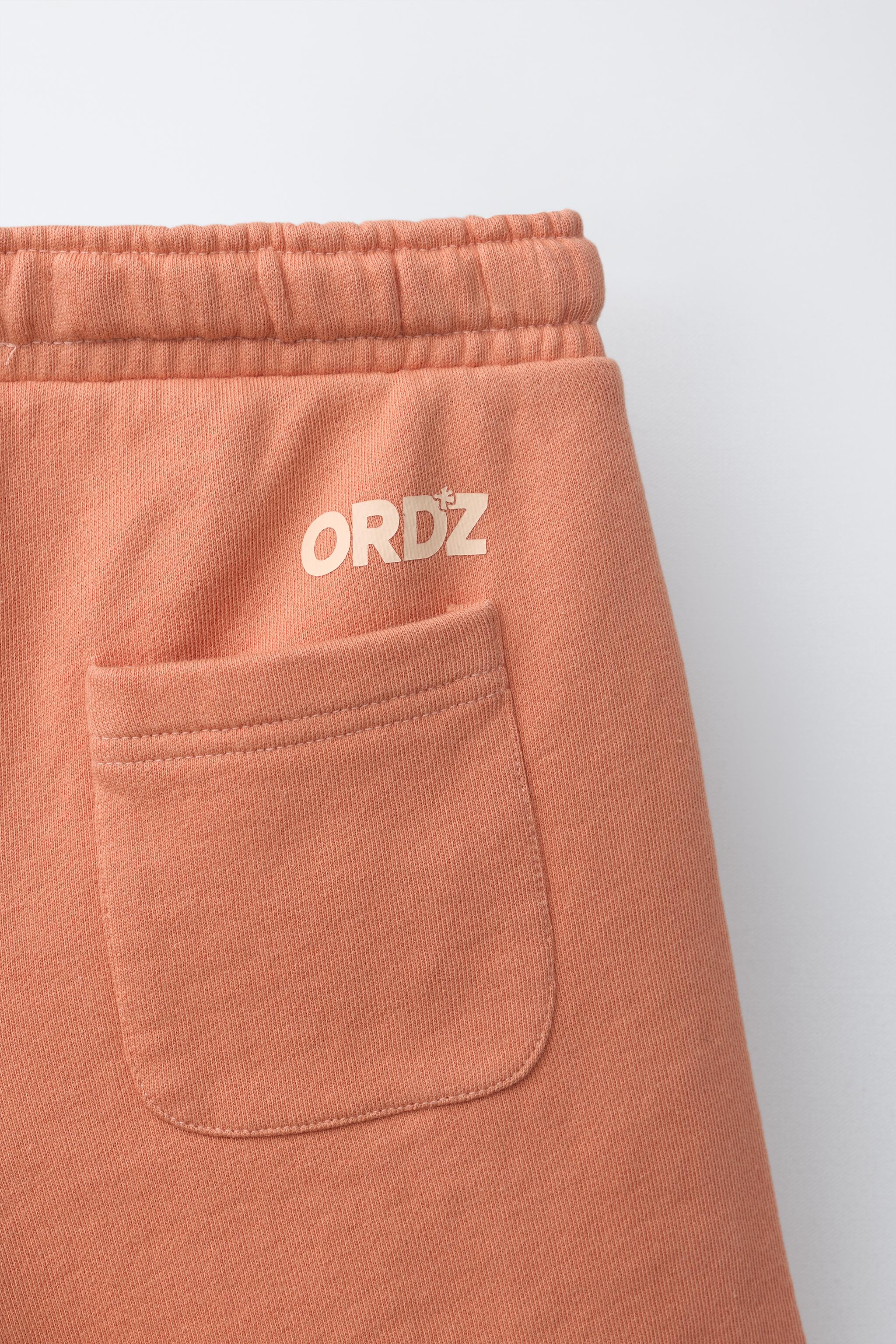 GARMENT DYED LOGO PLUSH SHORTS